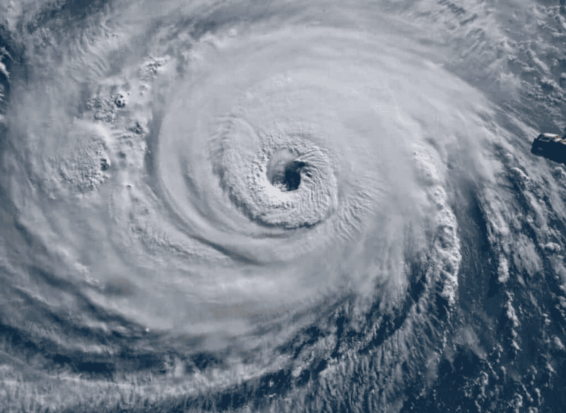 Hurricane storm formation from satellite view, showing powerful water storm with swirling clouds.