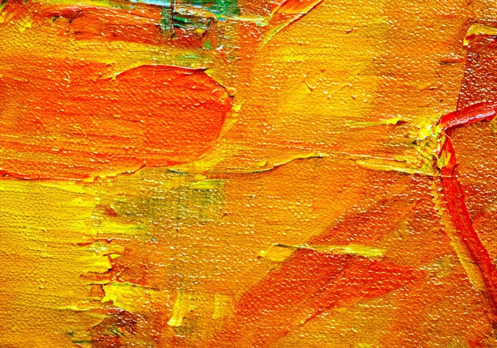 Vivid orange and gold leaves with textured brushstrokes on canvas.